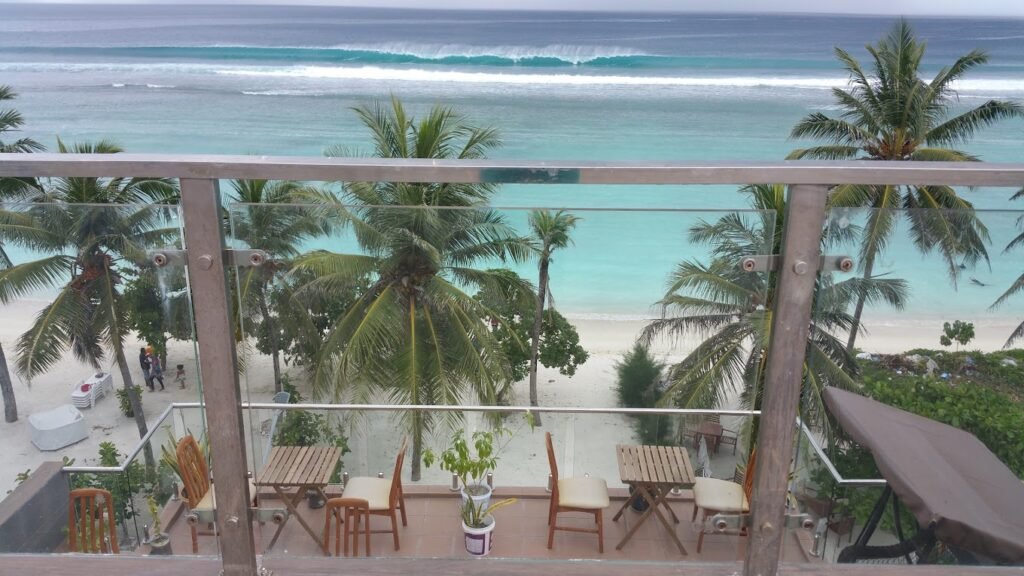 Pristine Hulhumale beach near Hathaa Beach Maldives with calm turquoise waters and palm trees