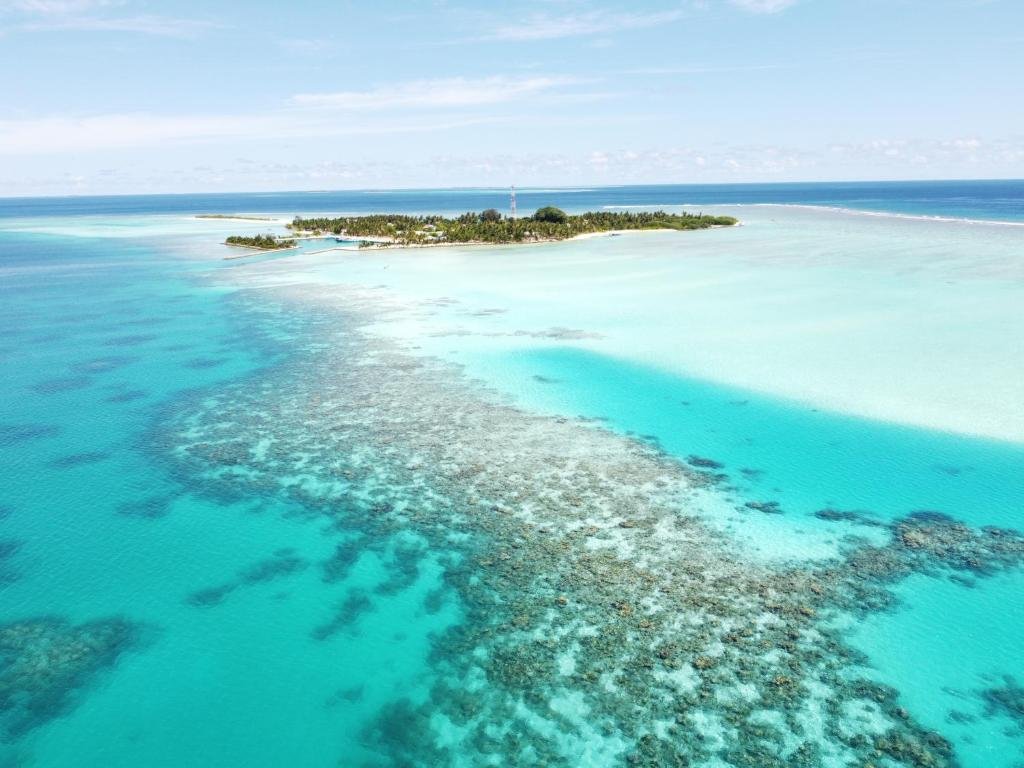 Mathiveri Beach near Mahchavaru Maldives with crystal-clear water and white sand.