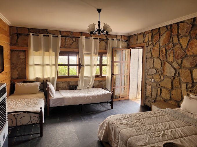 Family-friendly hotel room at Rise In Valley with mountain view and cozy decor.