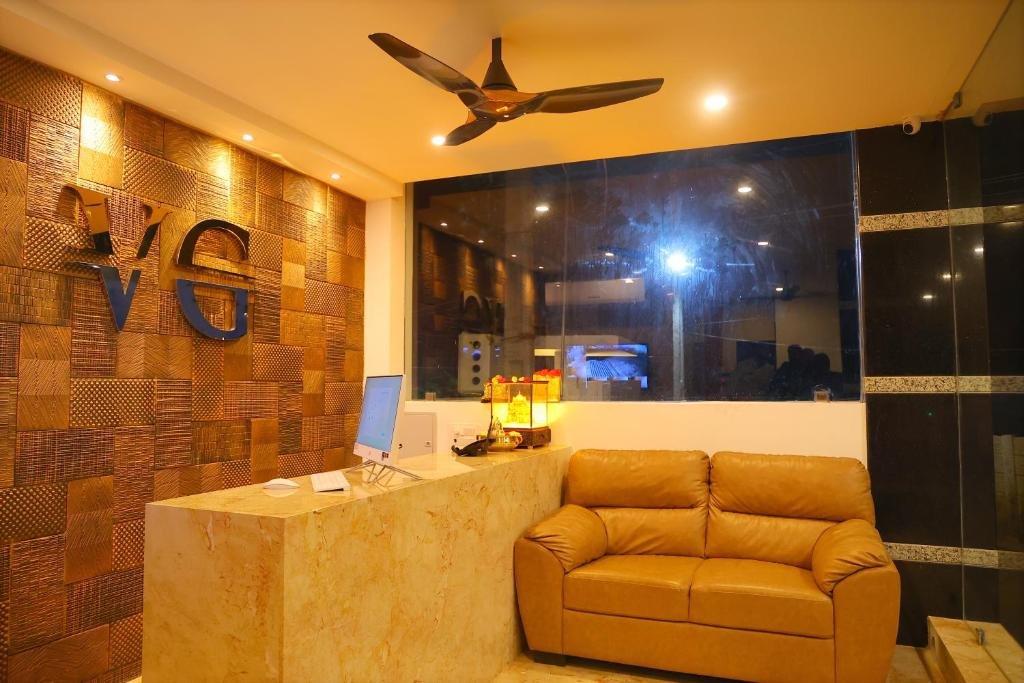 Reception area of Hotel Vijaya Grand Srikalahasti – clean and welcoming front desk with friendly staff ready to assist guests.