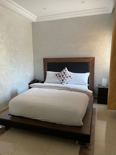Amwaj Hotel guest room interior with ocean view from balcony and modern Moroccan design