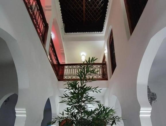 Comfortable Moroccan-style guest room at Riad Siham with traditional décor.