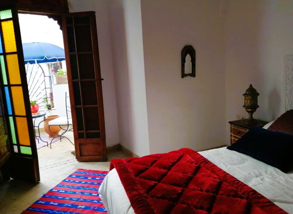 Cozy Moroccan interior with Berber carpets inside Riad Siham, El Jadida