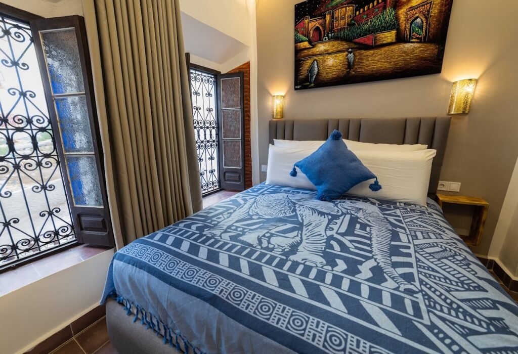 Cozy boutique room at Iguana Azul with Moroccan décor and courtyard view in Chefchaouen, Morocco