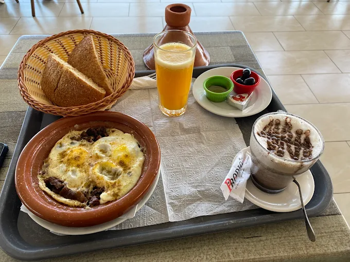 Moroccan breakfast buffet at Amwaj Hotel with msemen pancakes, fruit, and mint tea