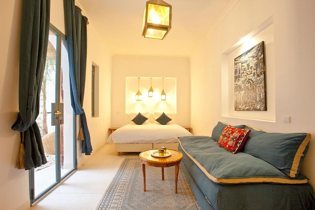 Comfortable guest room at Riad al Riad with Moroccan decor and natural ligh