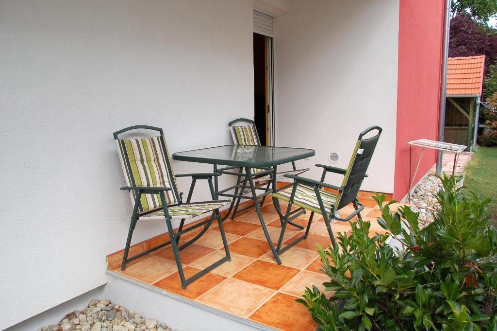 Balcony view from Laci Apartman overlooking a calm neighborhood in Zalakaros, Hungary