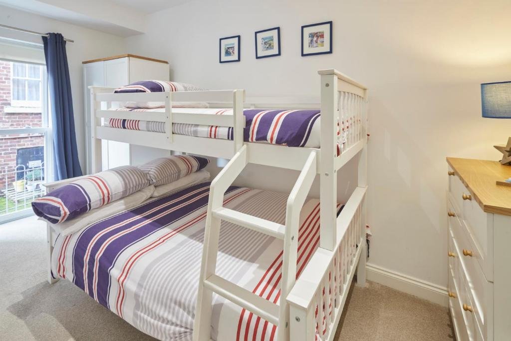 Bedroom at Host & Stay – Number 2 at Pannett Apartments in Whitby with soft bedding and calm decor