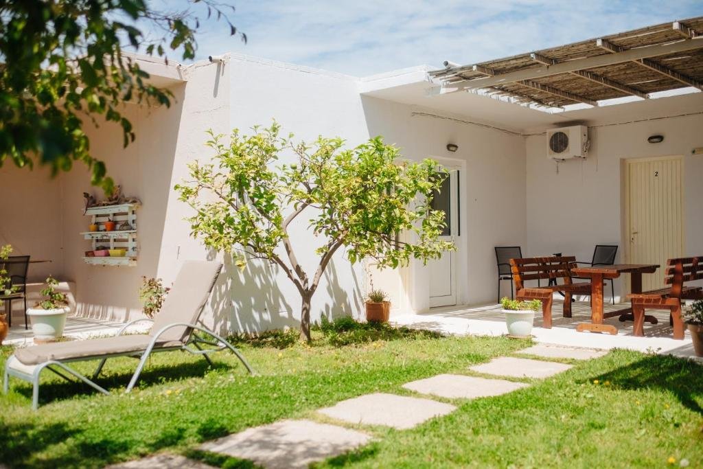 Outdoor dining area at Finikas Apartments with sea view in Plakias Greece