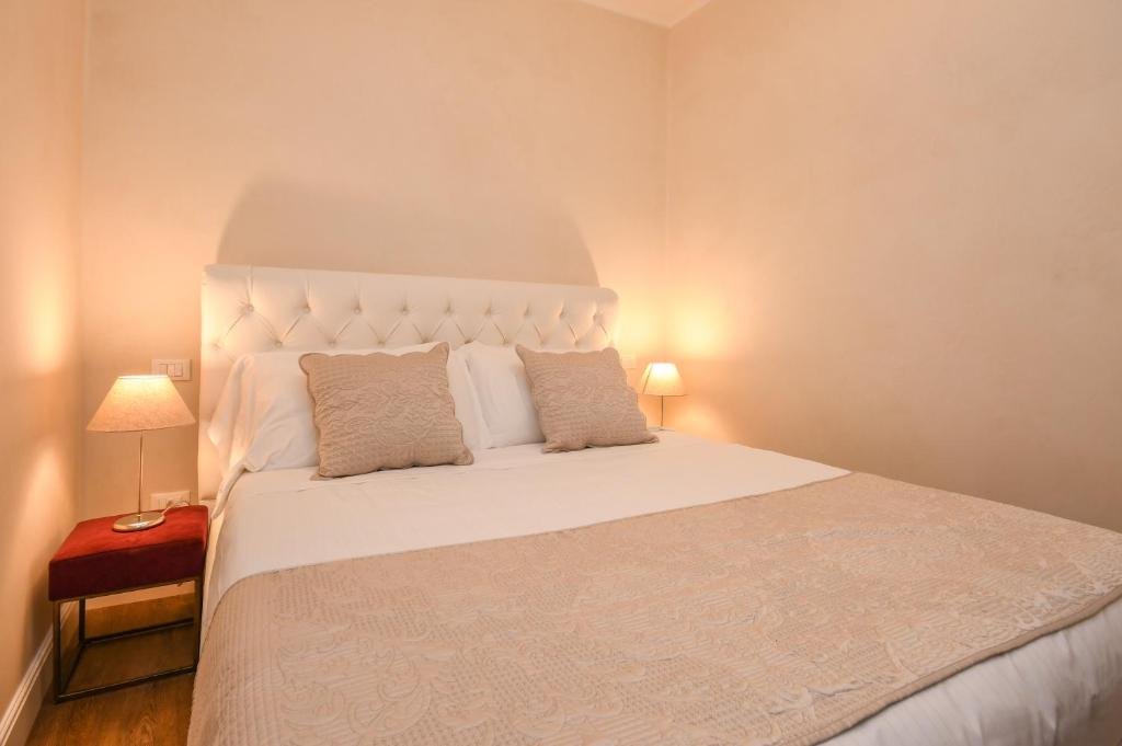 Comfortable bedroom at Luxury Suite Sirmione overlooking Sirmione Italy