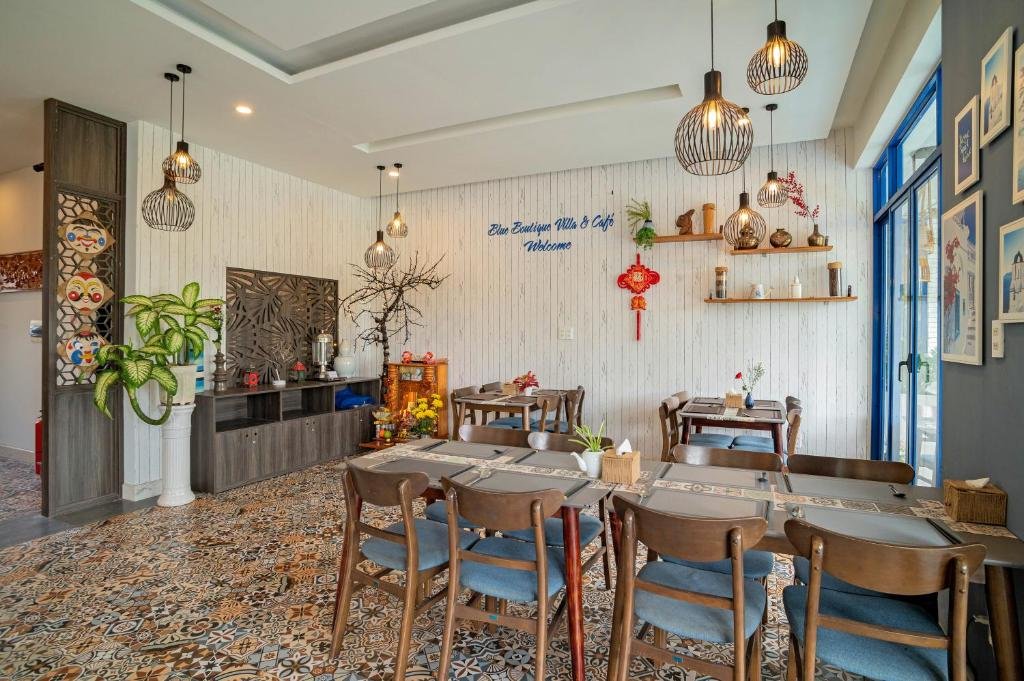 Vietnamese breakfast dishes and fresh tropical fruits at Blue Boutique Villa Hoi An