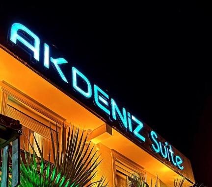 Entrance of Akdeniz Suites Hotel with Mediterranean-style architecture in Antalya