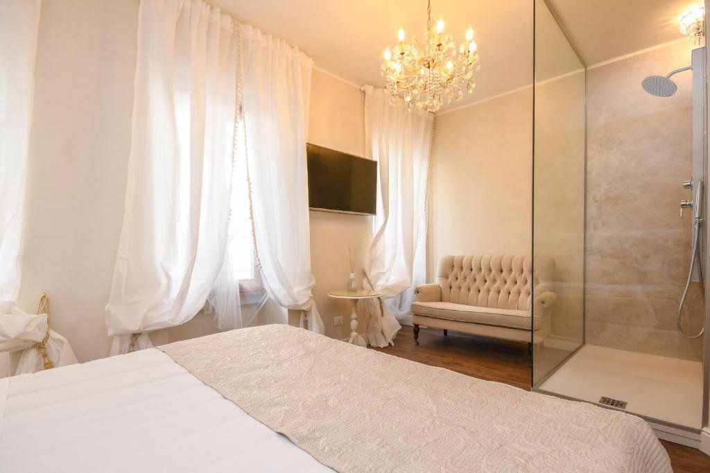 Comfortable bedroom at Luxury Suite Sirmione overlooking Sirmione Italy