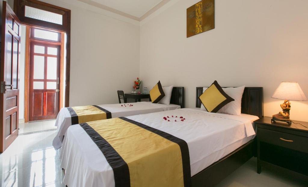 Clean and cozy bedroom at Snow Pearl Homestay in Hoi An, Vietnam