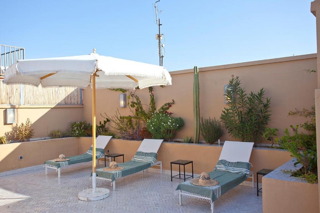 Rooftop terrace at Riad al Riad overlooking Marrakesh Medina rooftops