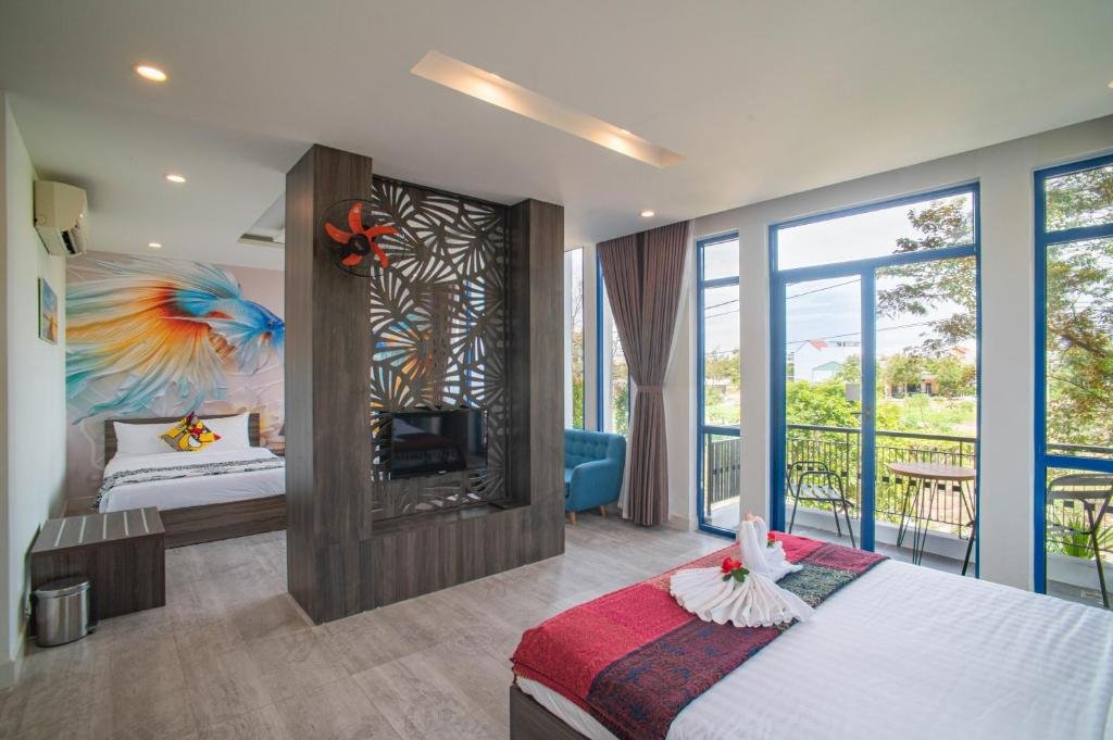 Private balcony view overlooking the river at Blue Boutique Villa Hoi An