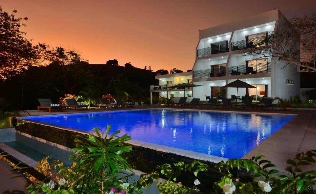 Exterior view of Nosy Be Sun Hôtel surrounded by tropical vegetation in Nosy Be, Madagascar