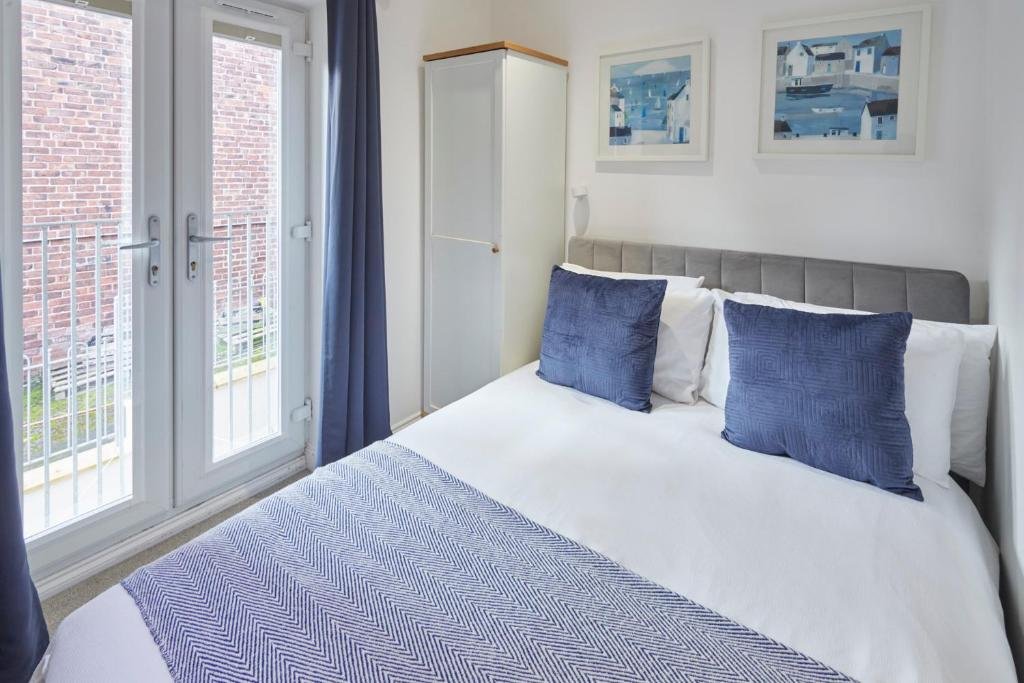 Bedroom at Host & Stay – Number 2 at Pannett Apartments in Whitby with soft bedding and calm decor