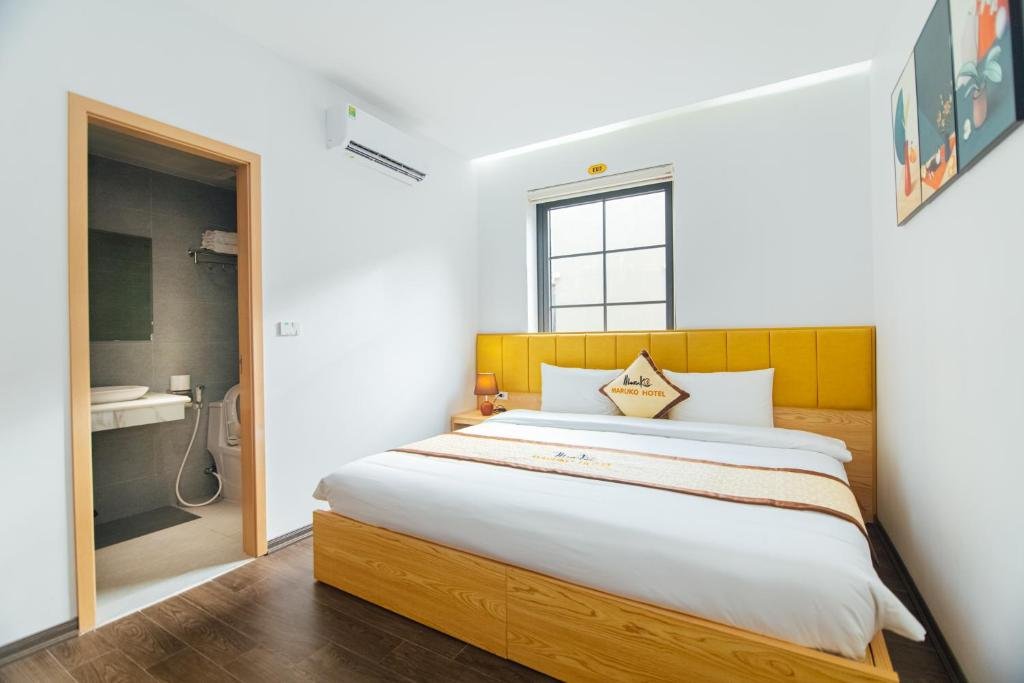 Clean and elegant bedroom at Maruko Hạ Long Hotel, Vietnam