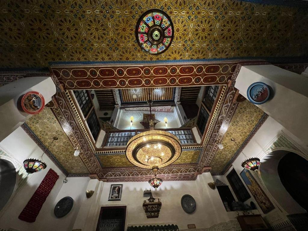 Interior design of Riad Abqari Youssefi with Moroccan tiles and arches