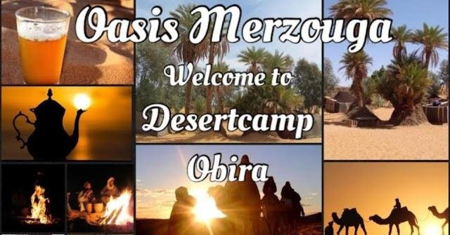 Obira Oasis Merzouga Camp in the Sahara Desert, Morocco surrounded by golden dunes