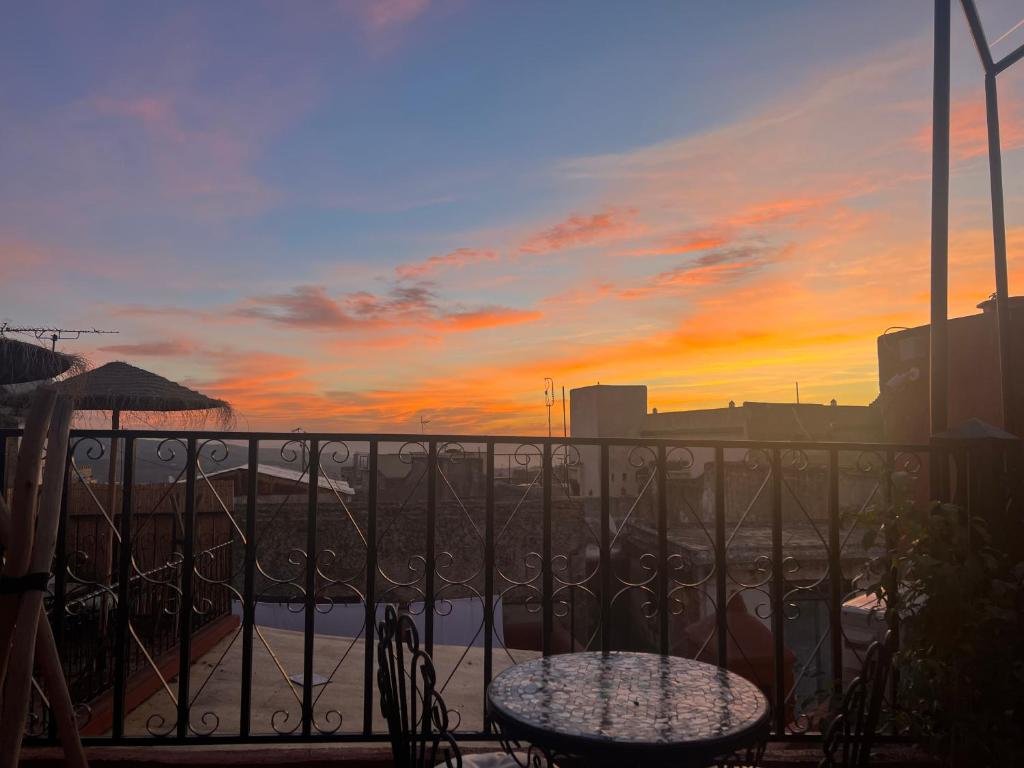 Sunset view from Riad Abqari Youssefi rooftop Fez Morocco
