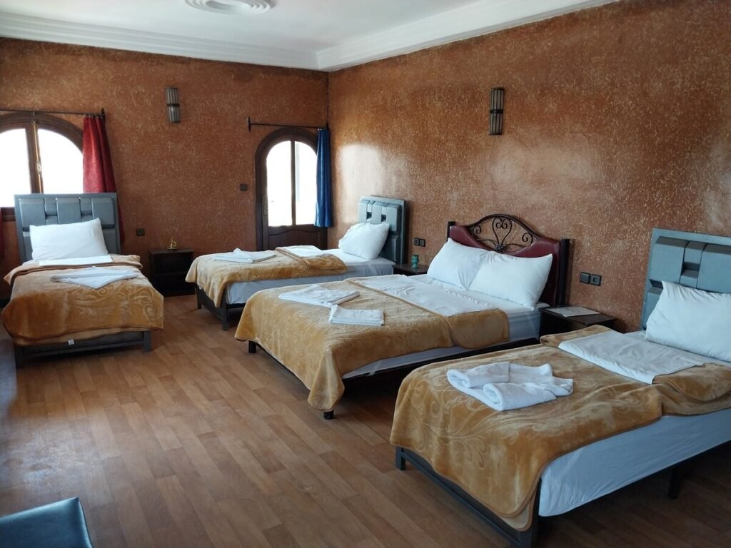 cozy bedroom at SUD-EST Palace with traditional Moroccan decor