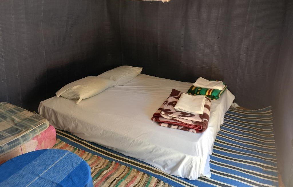 Authentic nomad-style tent in the Sahara at Obira Oasis Merzouga Camp