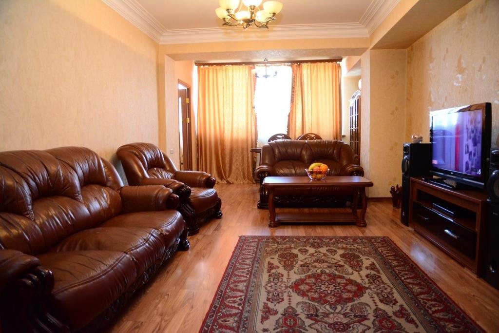 Bright and cozy living area inside LeSi Apartament in Yerevan, Armenia, with comfortable seating and natural light