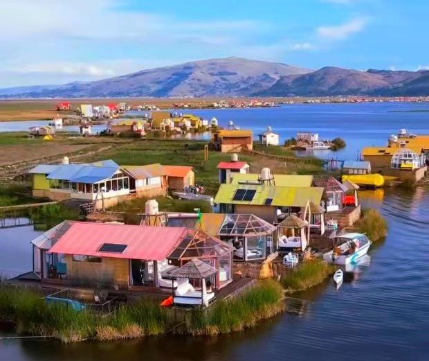 Aerial view of Uros floating islands and UROS KAY PACHA Lodge on Lake Titicaca Peru