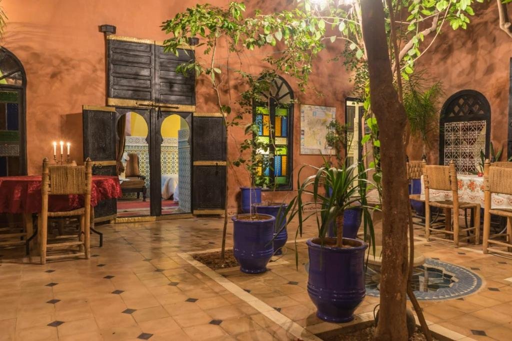 Riad Sidi Omar peaceful courtyard with Moroccan tiles and plants