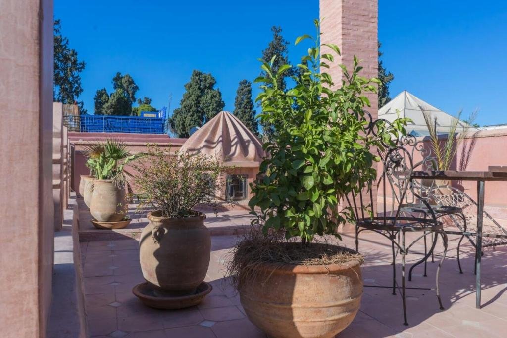 Rooftop terrace at Riad Sidi Omar with Marrakech skyline view