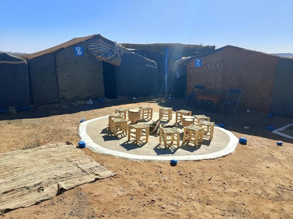 Cozy desert tent interior at Obira Oasis Merzouga Camp Morocco