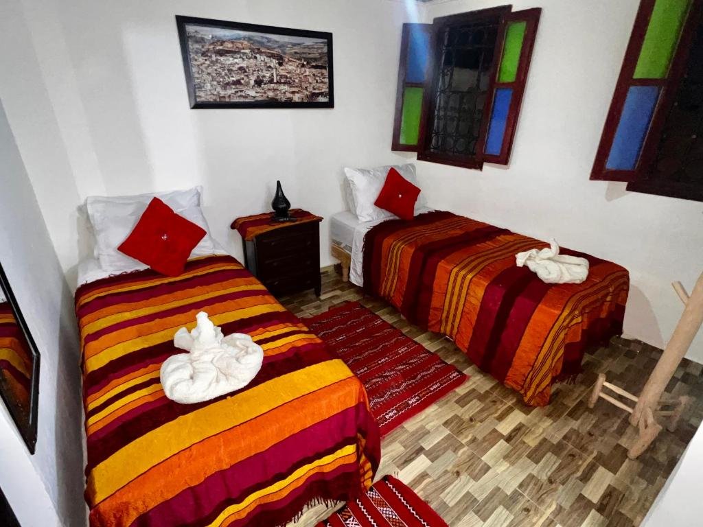 Traditional Moroccan bedroom decor at Riad Abqari Youssefi