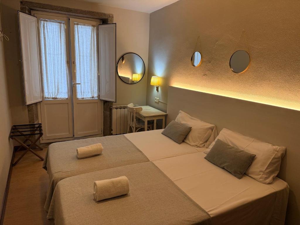 Bright and cozy hotel room with city views at Hotel Real