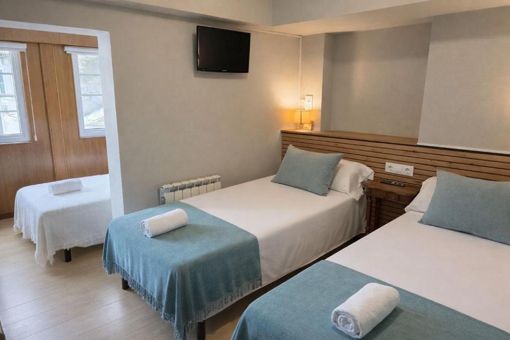 Modern and comfortable bedroom at Hotel Real Santiago de Compostela