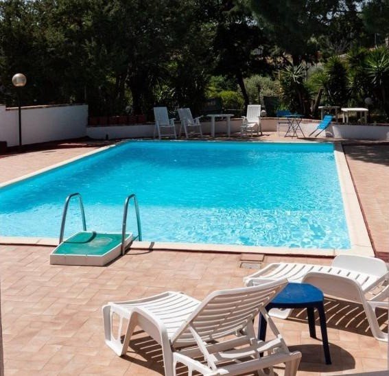 Outdoor swimming pool at Hotel Sa Lolla, Sardinia